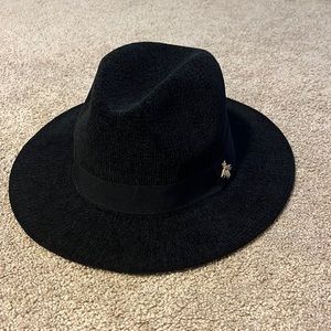 Woman’s black fedora hat